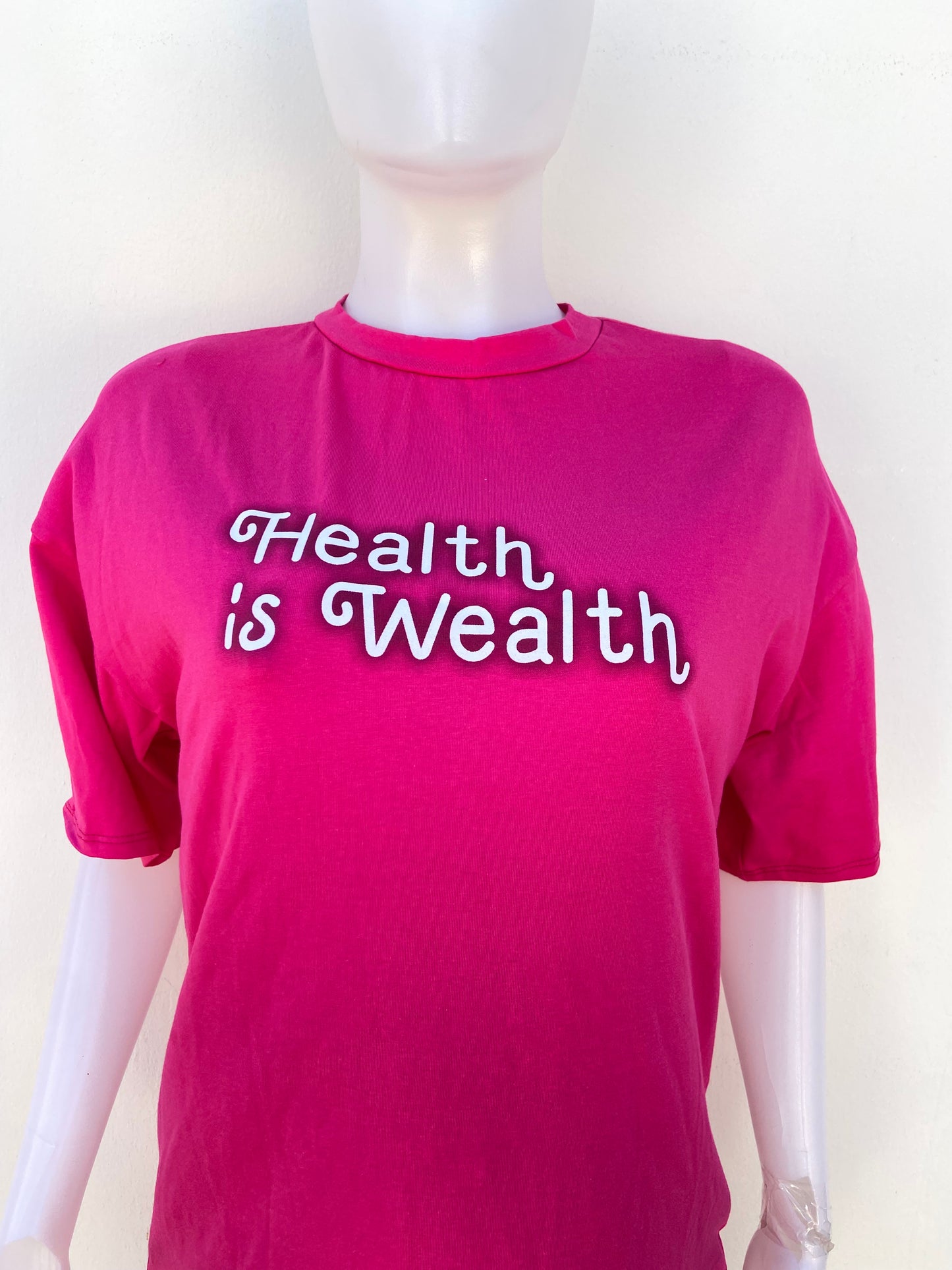Conjunto, rosado de Legging y T-shirt con letras HEALTH IS WEALTH (la salud es riqueza)