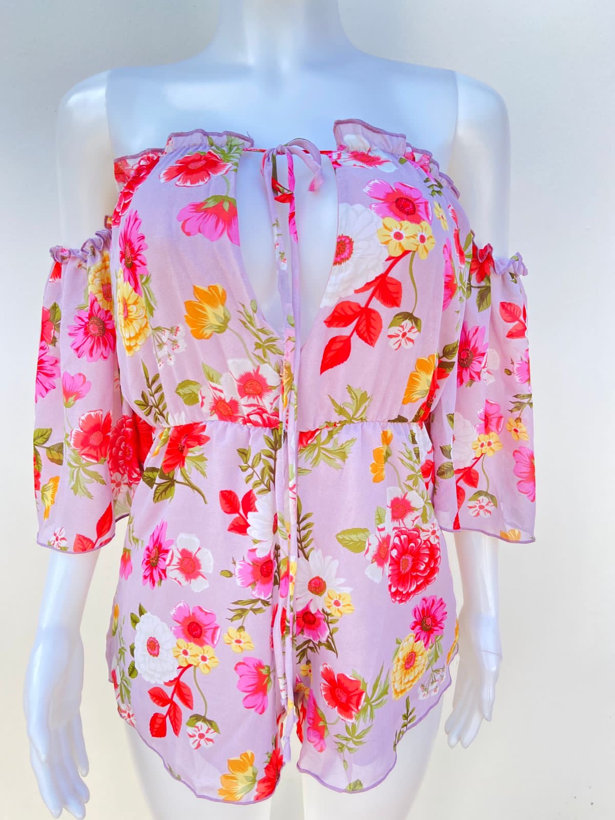 Enterizo color rosado con varias rosas.