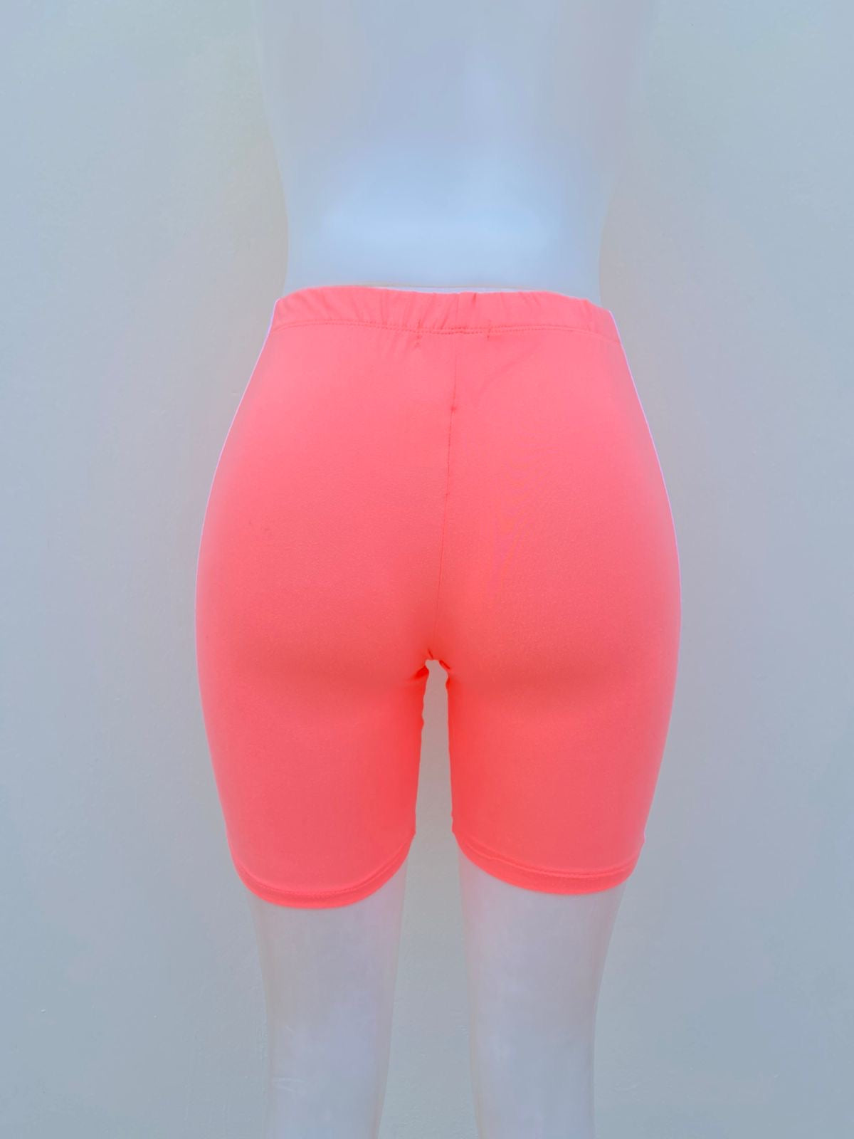 Legging/licra CHILLIPOP original, color naranja ( salmón ) con raya en color blanco al lado, bicicleta.