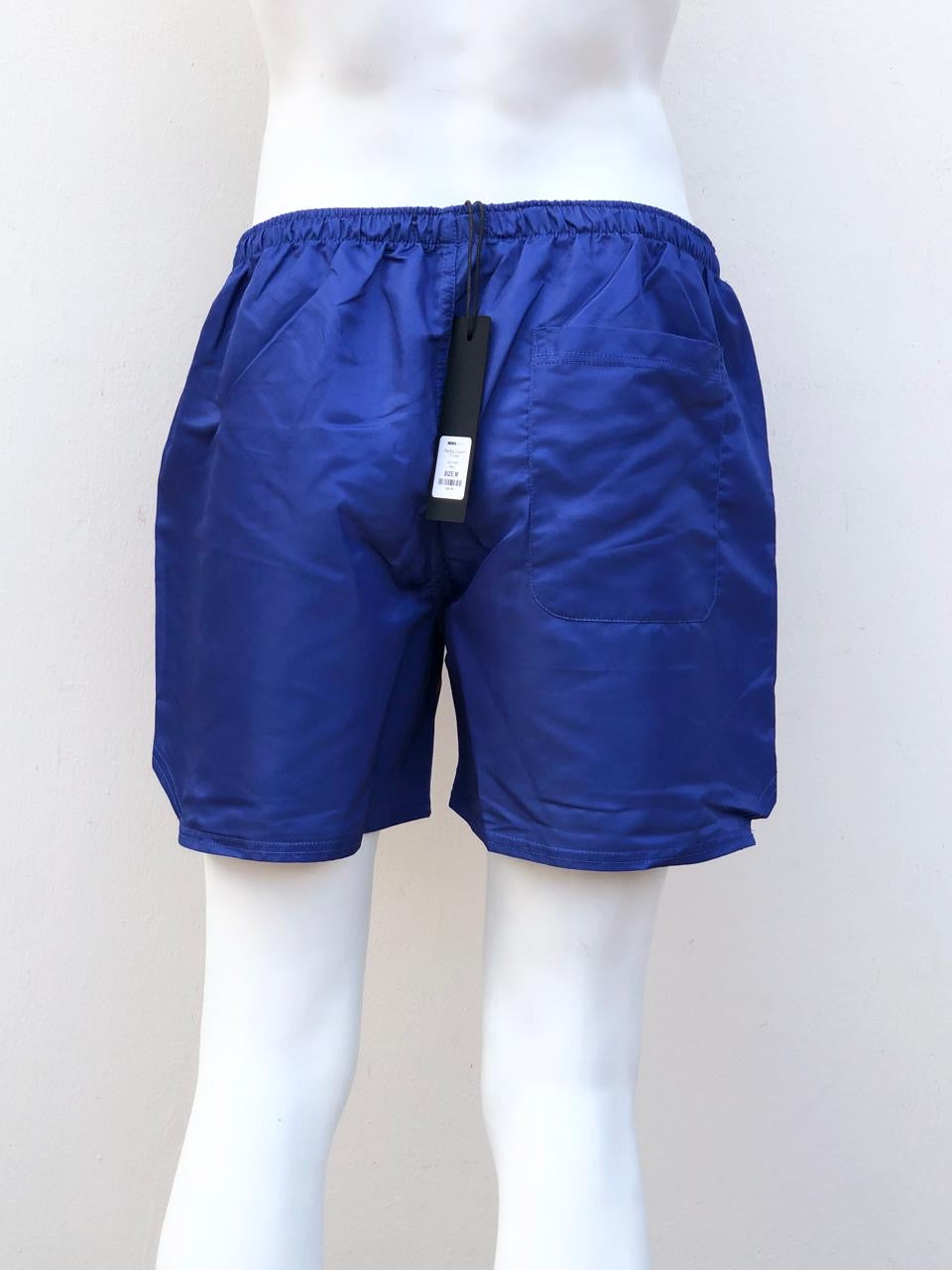 Bañador Baggy, azul Navy con diseño de líneas en color rosado.