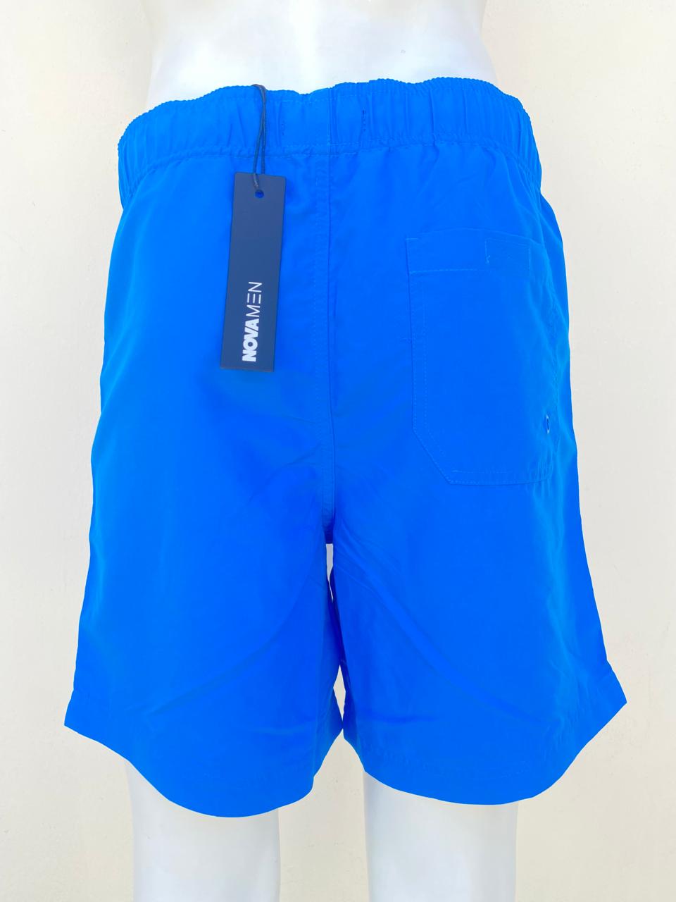 Bañador Baggy azul con lazos ajustables y detalles en plateado .