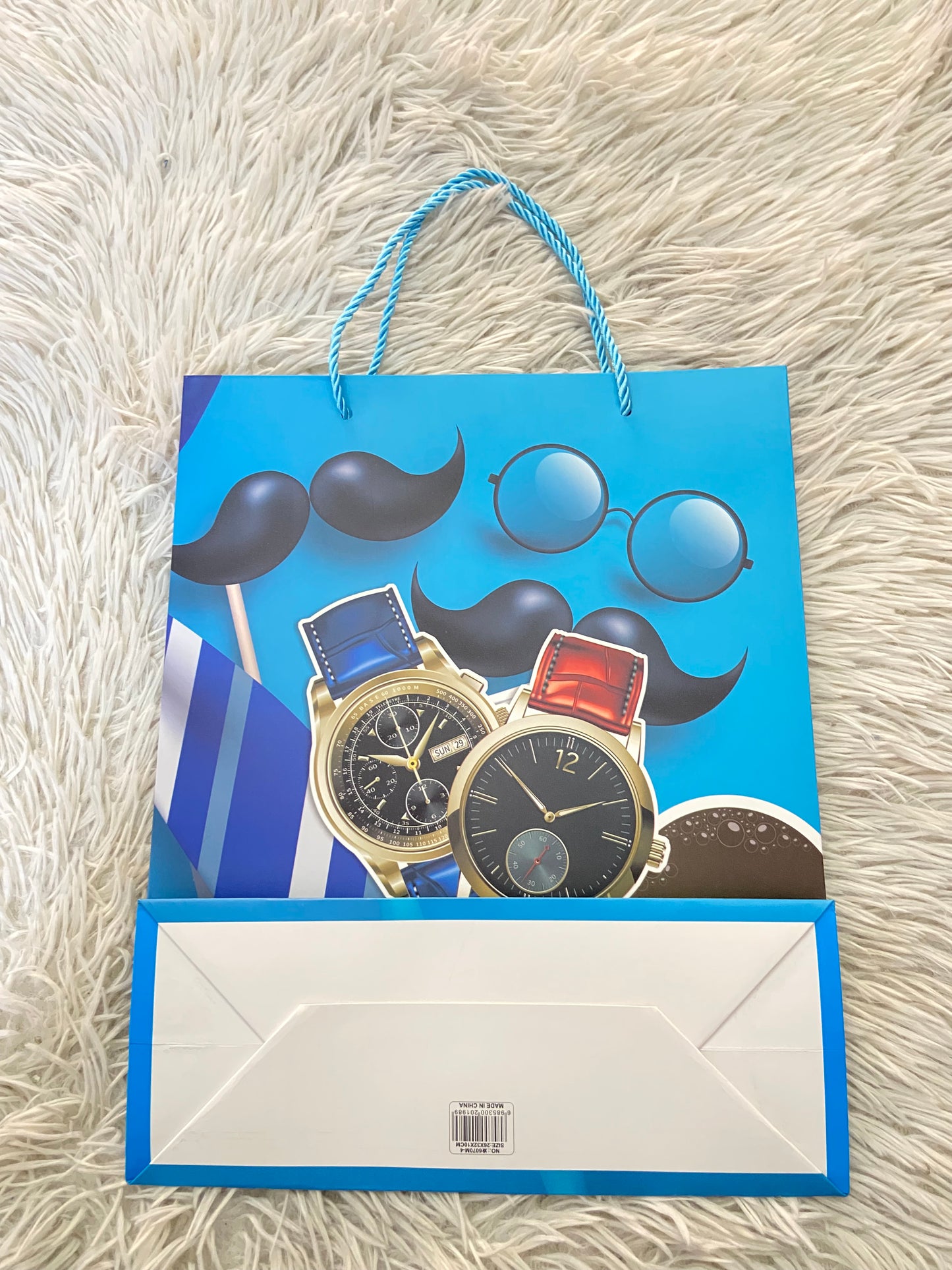 Shopping, azul con estampado de relojes y lentes.