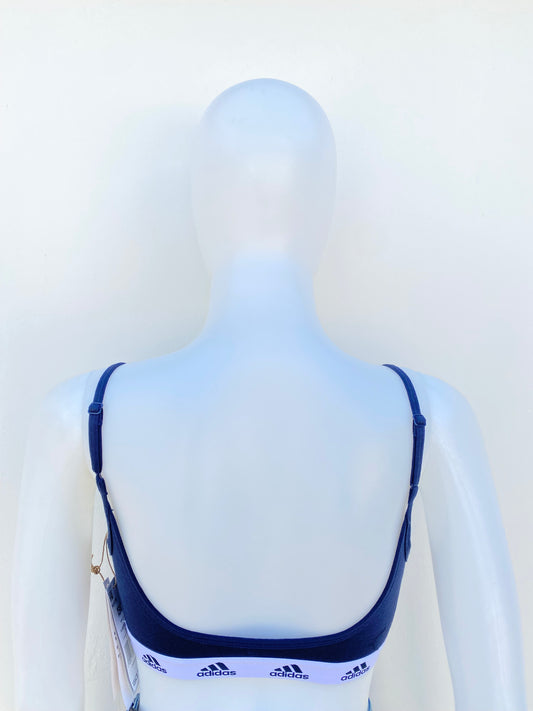 Top/ bra ADIDAS original, azul marino, con elástico blanco y logotipo y letras ADIDAS de color azul marino.