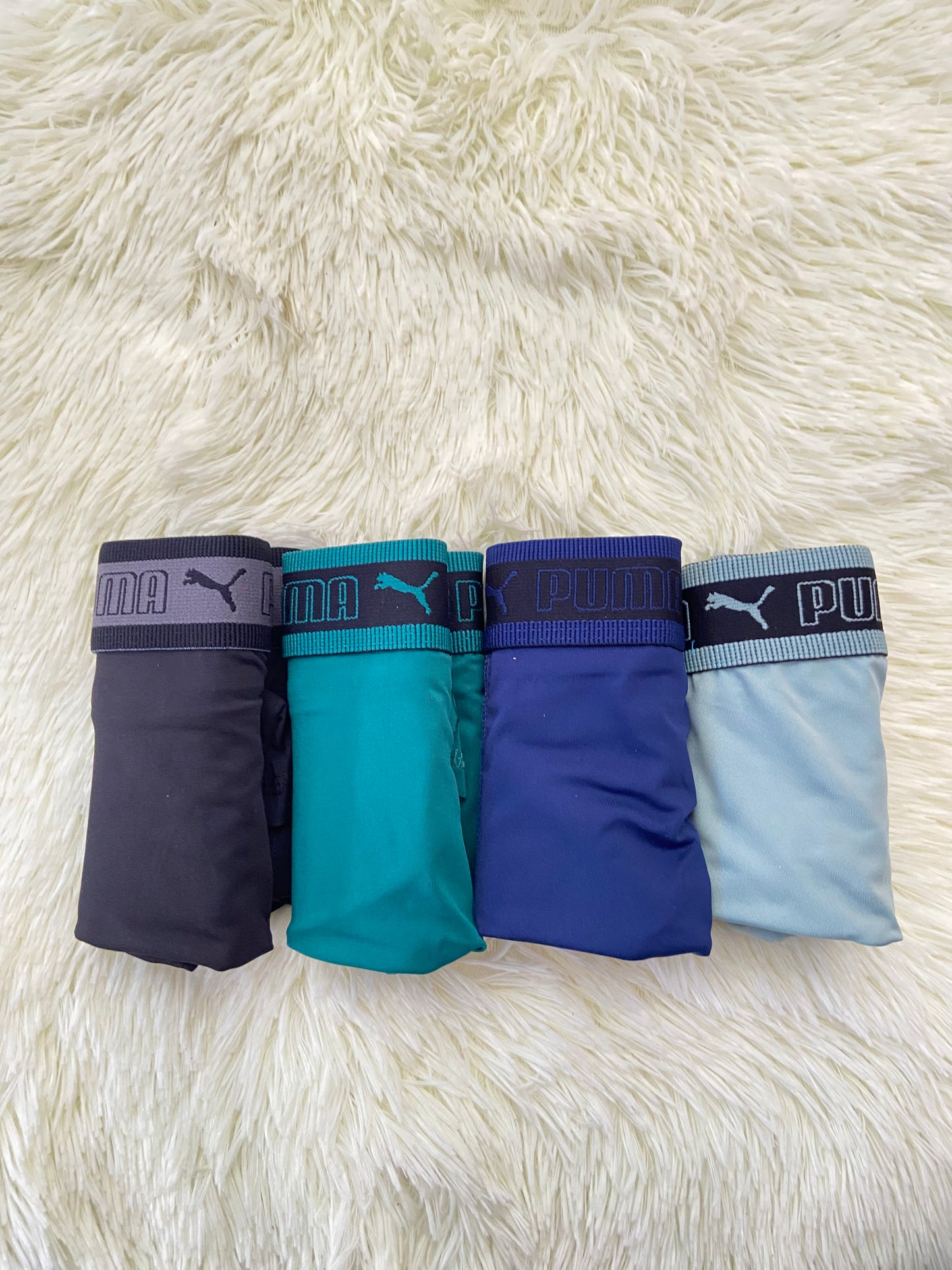 Pack-4 Boxer PUMA original, en colores negro, verde,azul marino y azul claro.