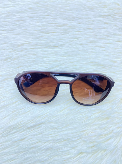 Lentes, marron con micas claras redondos y protecciones UV 400.