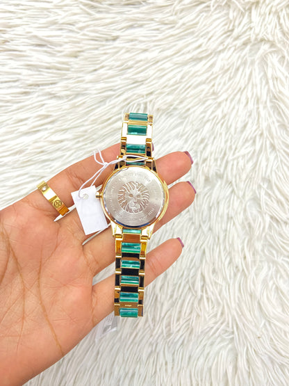 Reloj ANNE KLEIN original, color dorado con verde jade ( mármol ) con detalles dorados y verde.