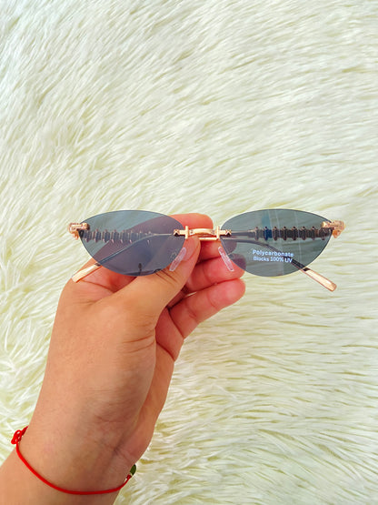 Lentes montura metálica color rosado/dorado estilo cat-eye.