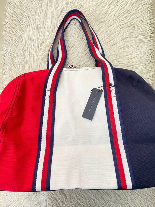 Bulto Tommy Hilfiger Original en color azul marino blanco y rojo con logotigo de la marca al frente