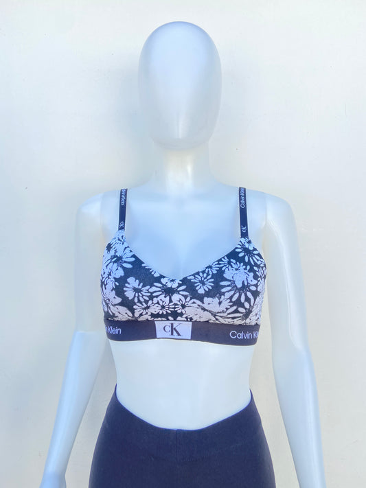 Bra Calvin Klein original negro con blanco y estampado de flores.