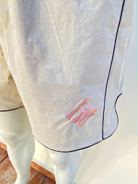 Bañador, crema ( sand ) con línea en color negro al rededor y lazos ajustables.