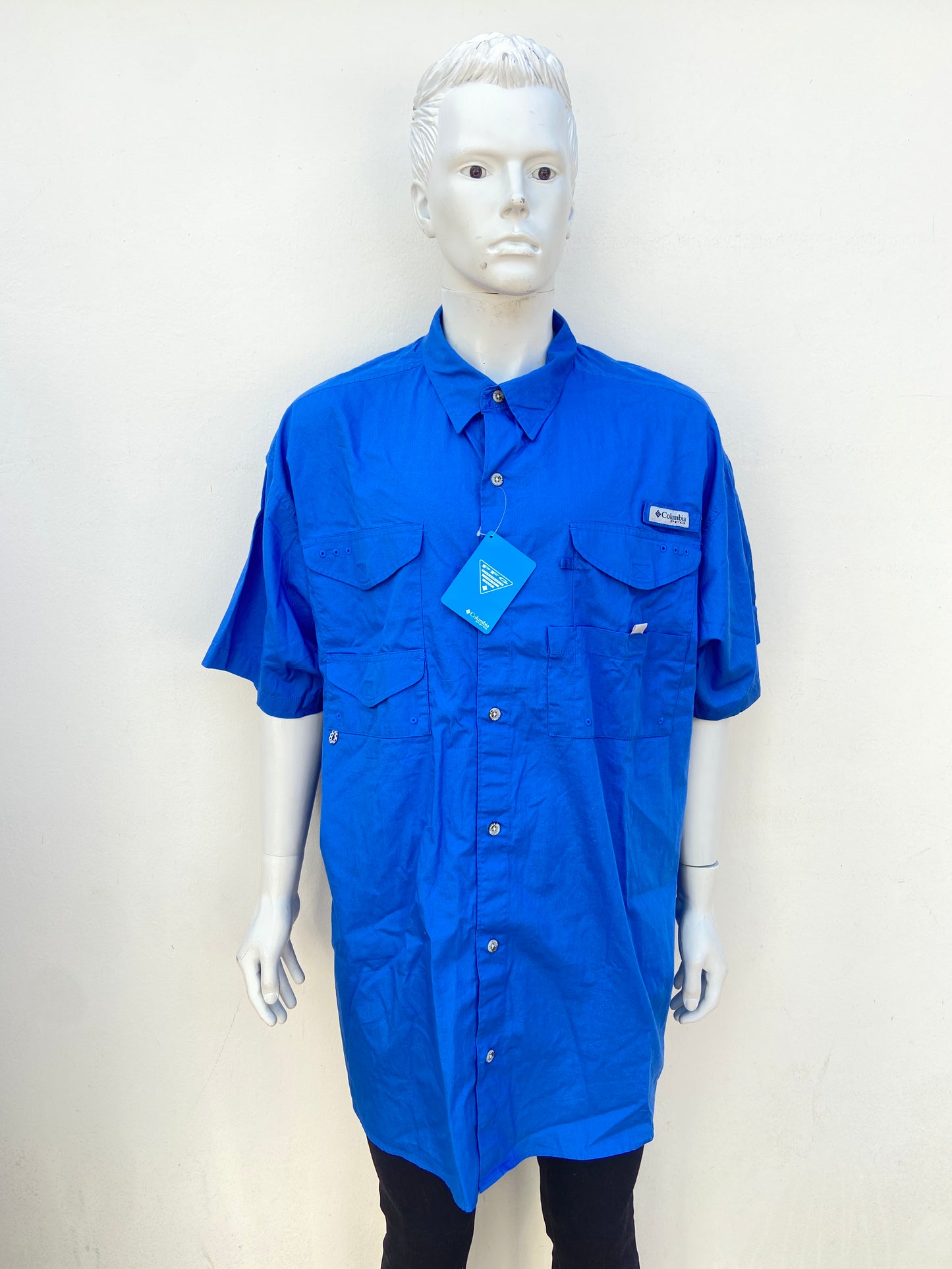 Camisa COLUMBIA original azul rey con logotipo de la marca en gris .