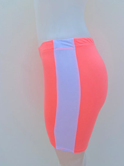 Legging/licra CHILLIPOP original, color naranja ( salmón ) con raya en color blanco al lado, bicicleta.