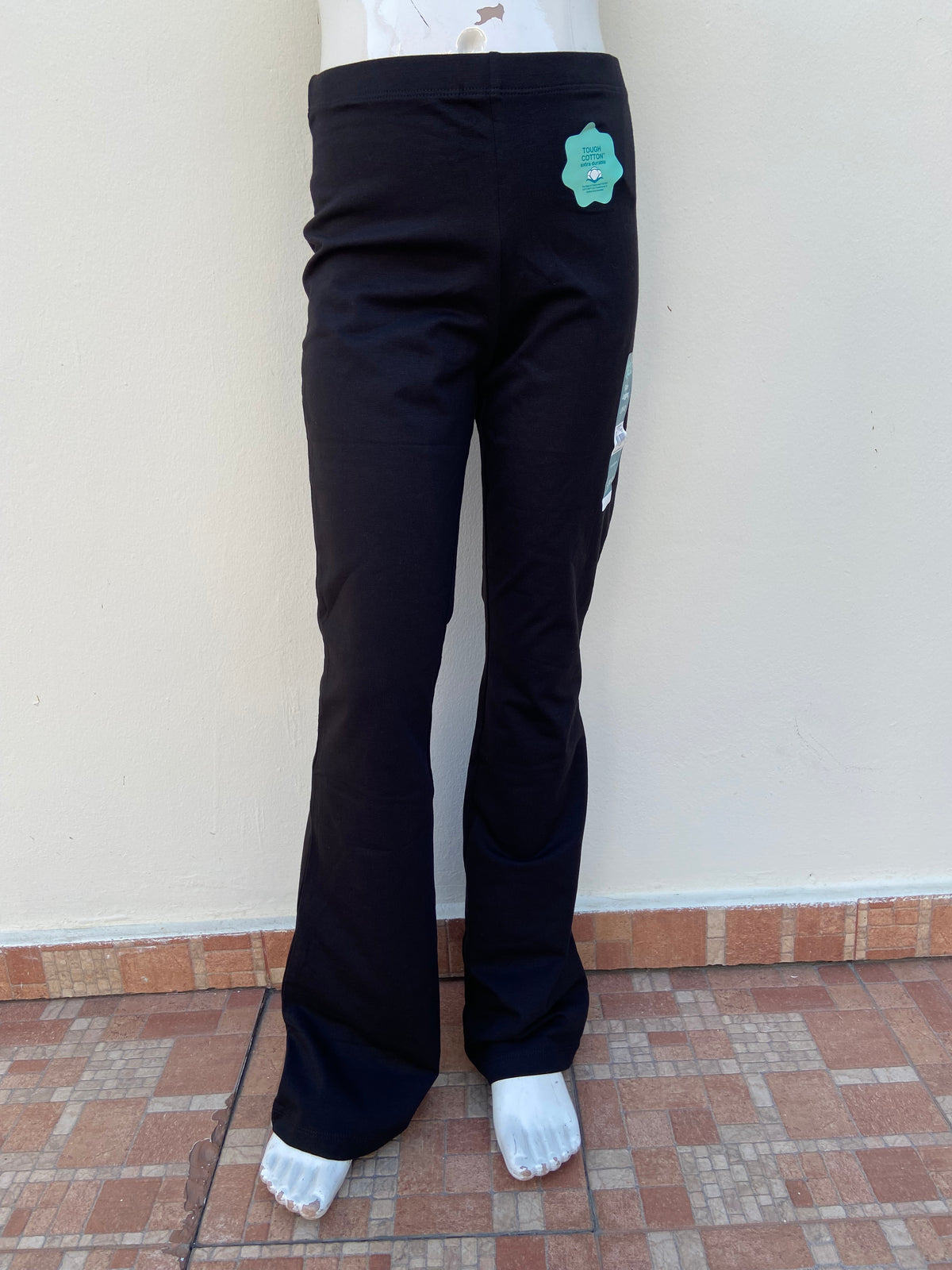 Legging WONDER NATION original en color negro liso, campana abajo