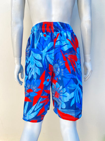 Bañador/Baggy KANU SURF original, azul con estampado de flores naranja, interior en malla transpirable con bolsillos laterales.