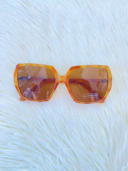 Lentes, marron claro con estampado de animal print y micas claras, con protección UV 100-400.