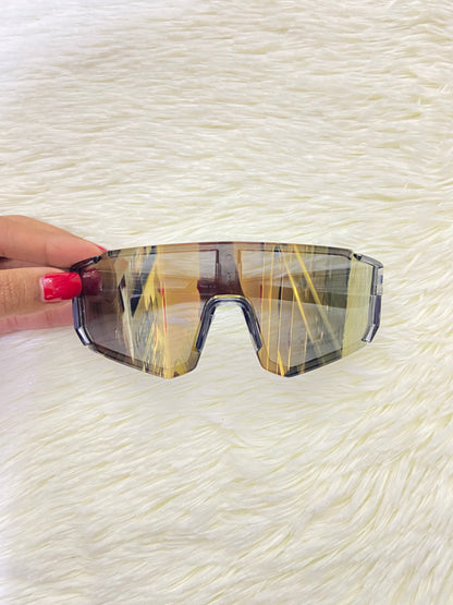Lentes, gris con micas que cambian de color a dorado cromados, 100 % Polycarbonate más protección UV.
