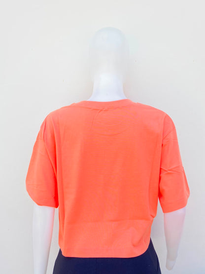 Top The Rolling Stones original,naranja claro con estampado de boca y letras THE ROLLING STONES.