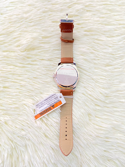 Reloj U.S POLO original, marron con costura en hilo azul, y fondo azul con plateado.
