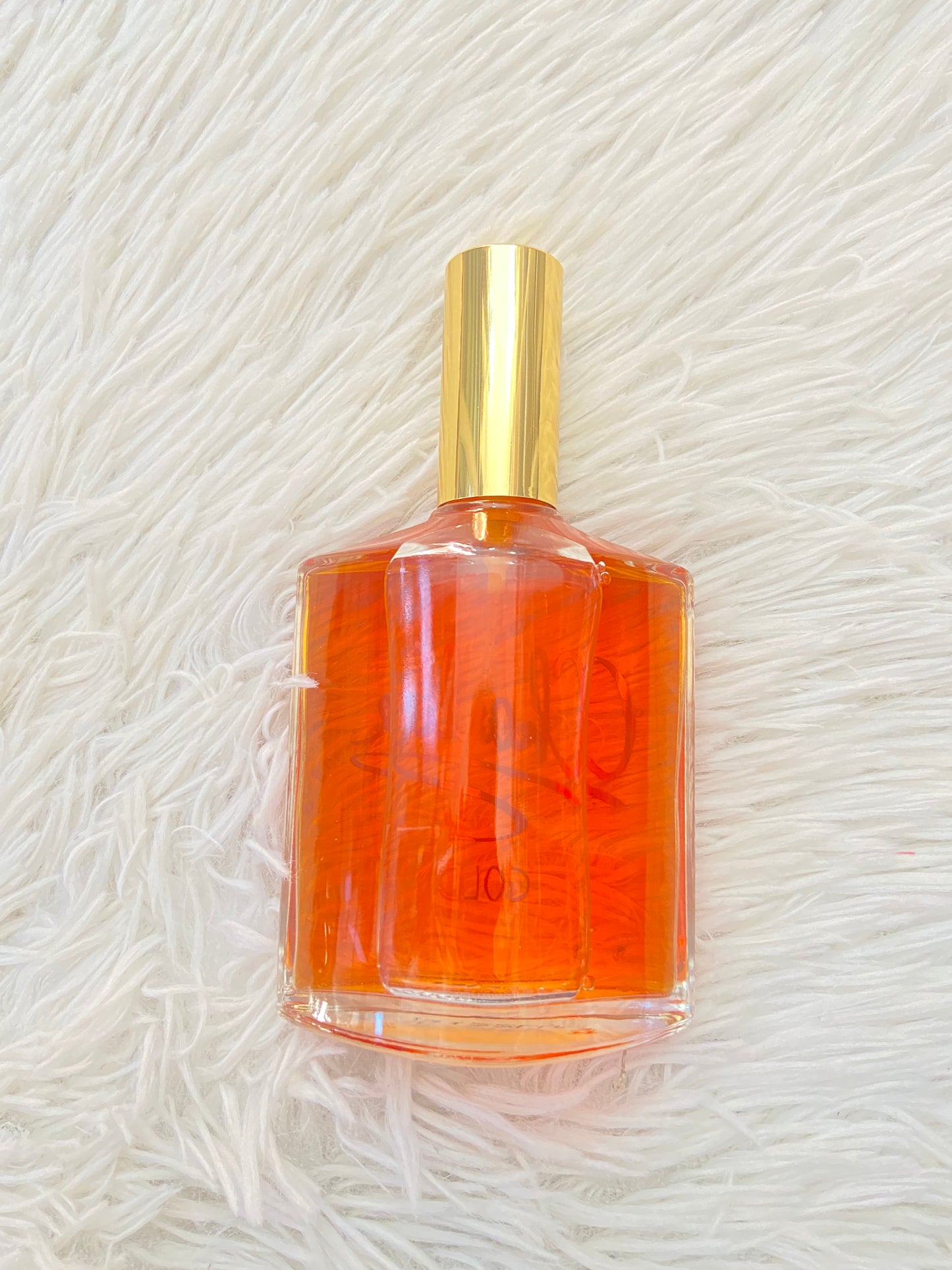 Perfume REVLON CHARLIE GOLD original naranja con detalles dorados.