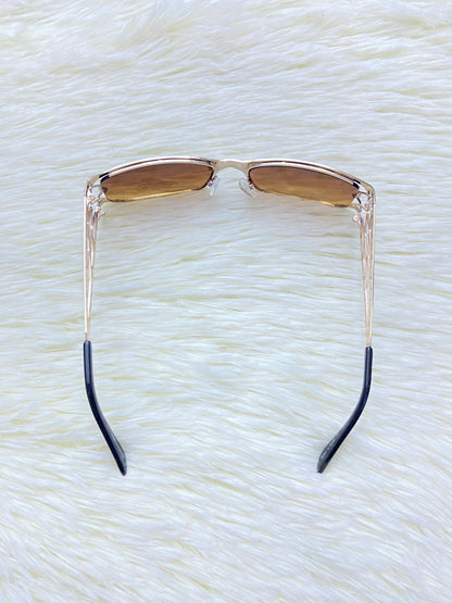 Lentes, marron con diseño abierto en la montura, más protección UV 100%.