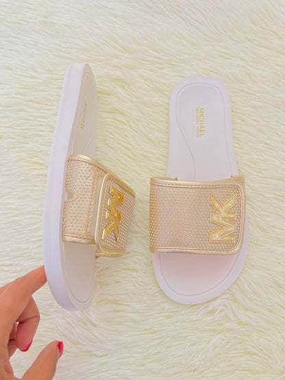 Sandalias MICHAEL KORS original, dorado con blanco y letras MK al lado.