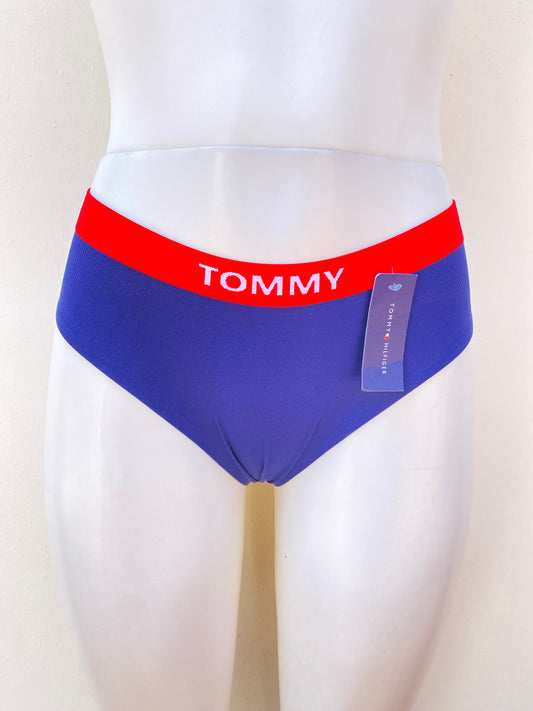 Panti Tommy Hilfiger original, azul con borde rojo, con letras Hilfiger.