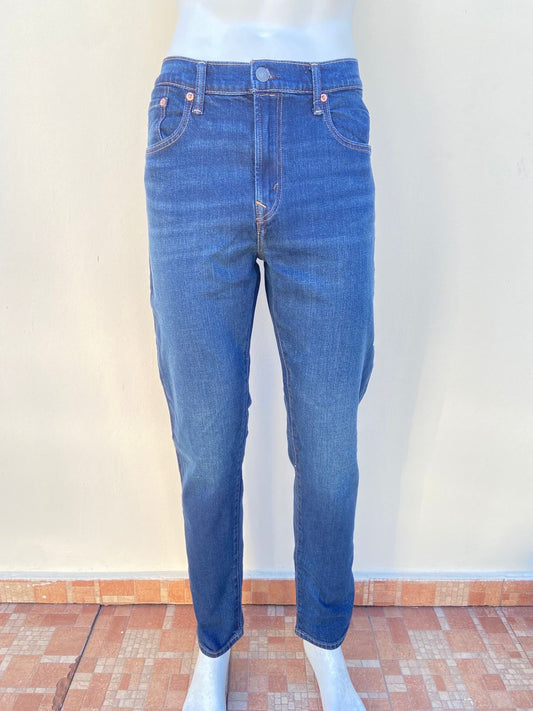 Pantalon jean AMERICAN EAGLE Original, en color azul oscuro liso Airflex ATHLETIC FIT.