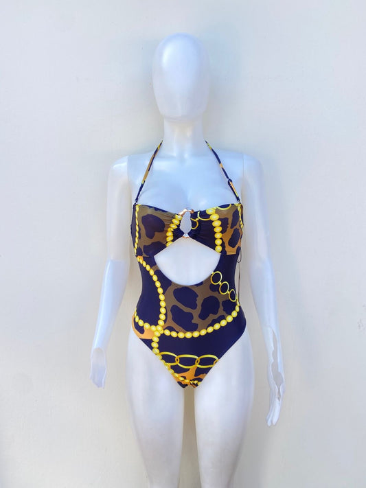 Biquini, negro con estampado de animal printe en amarillo y naranja, una pieza.