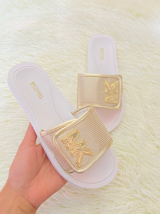 Sandalias MICHAEL KORS original, dorado con blanco y letras MK al lado.