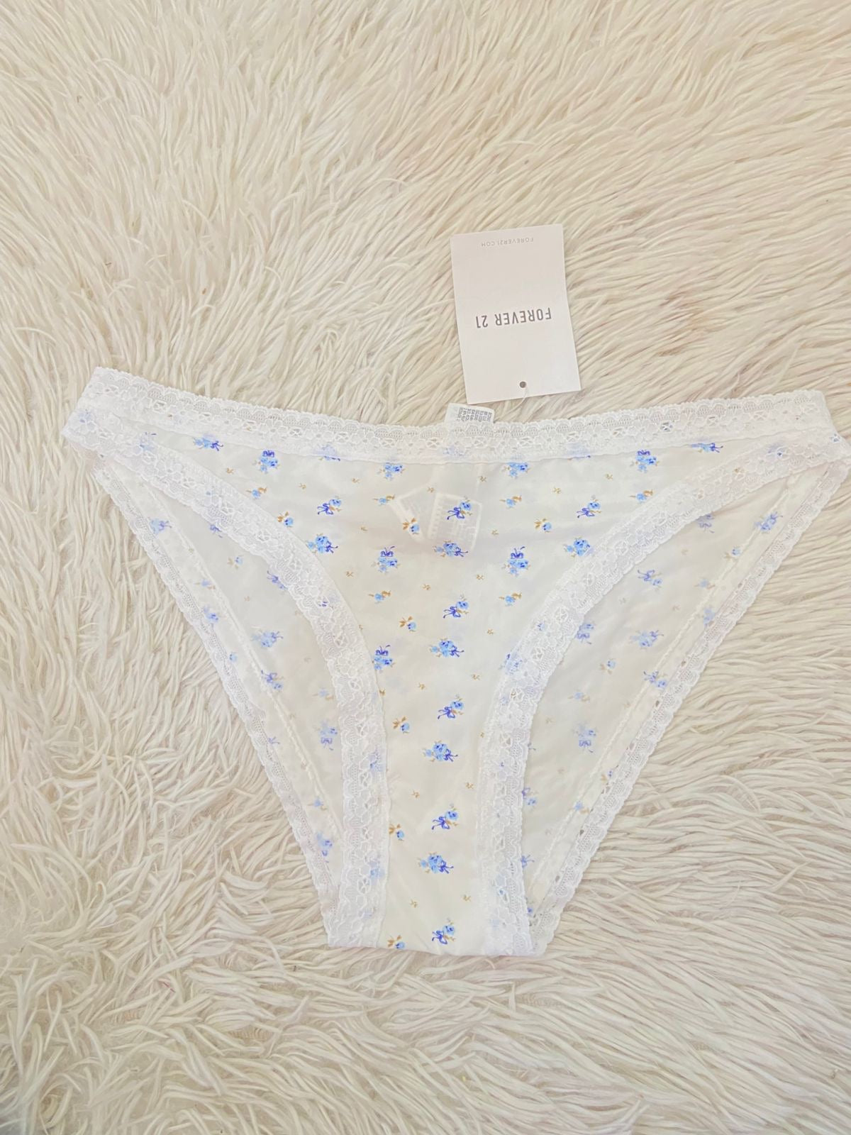 Panti Forever 21 original blanco con estampado de Flores azul.