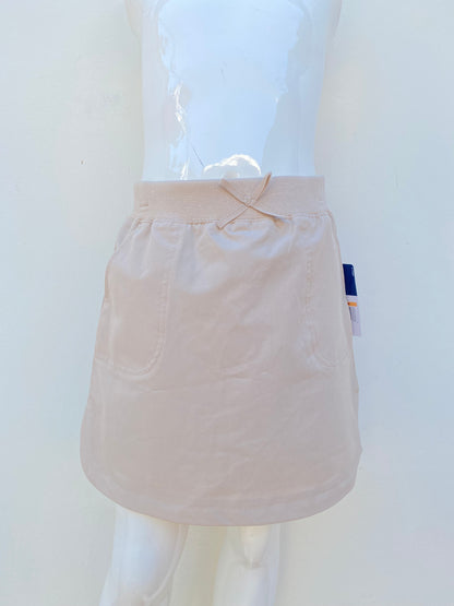 Falda con pantalon abajo para niñas IZOD original, crema con bolsillos.