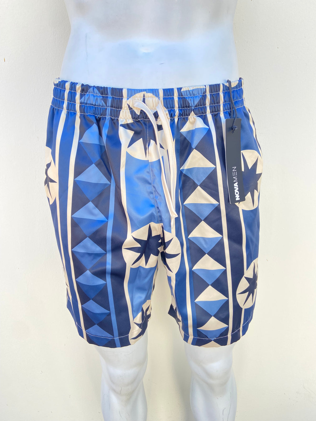 Bañador/Baggy, azul marino con crema y estampado de figuras.