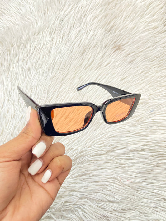 Lentes Fashion Nova original negros con micas naranja.