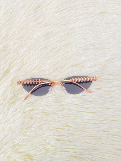 Lentes montura metálica color rosado/dorado estilo cat-eye.