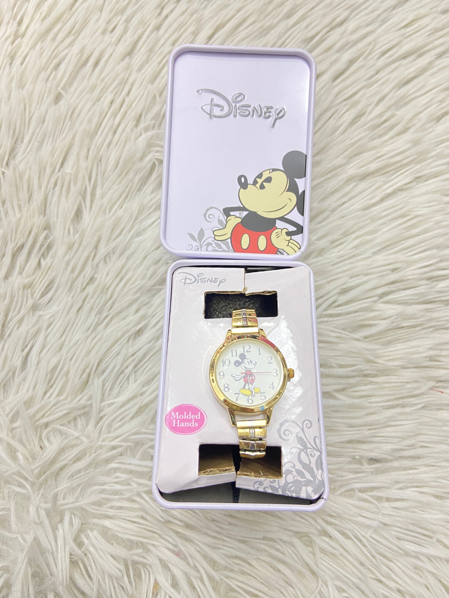 Reloj Disney original con Mikey mouse de fondo en dorado.