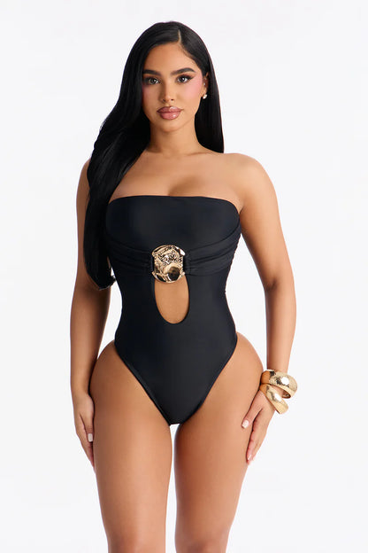 Biquini, negro con abierto  en frente y placa en color dorada, strapless, 1 pieza.