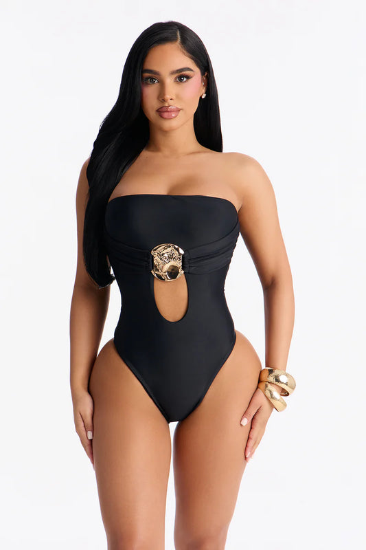 Biquini, negro con abierto  en frente y placa en color dorada, strapless, 1 pieza.