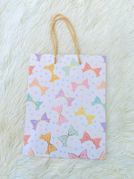 Shopping, blanco  con estampado de moños en colores, PEQUEÑO.