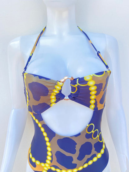 Biquini, negro con estampado de animal printe en amarillo y naranja, una pieza.