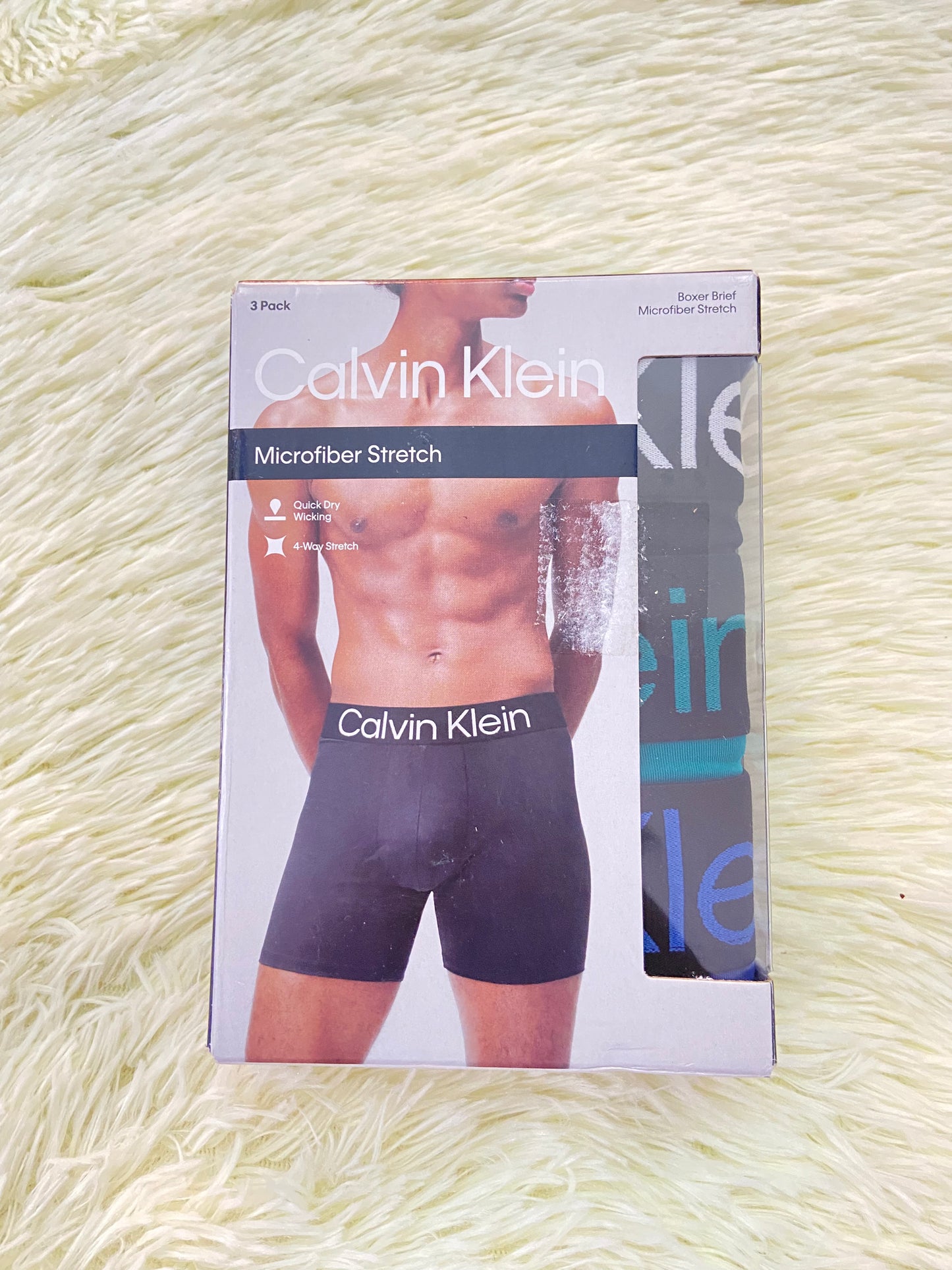 Pack-3 Boxer CALVIN KLEIN original, azul, verde Aqua y  negro con letras de la marca en la pretina.