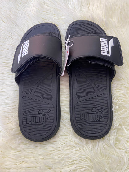 Sandalias PUMA original, negra con letras PUMA eñ color blanco en los lado.