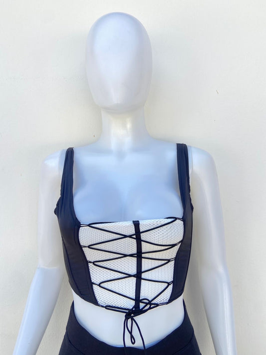 Top, negro con blanco estilo corset y lazos ajustables.