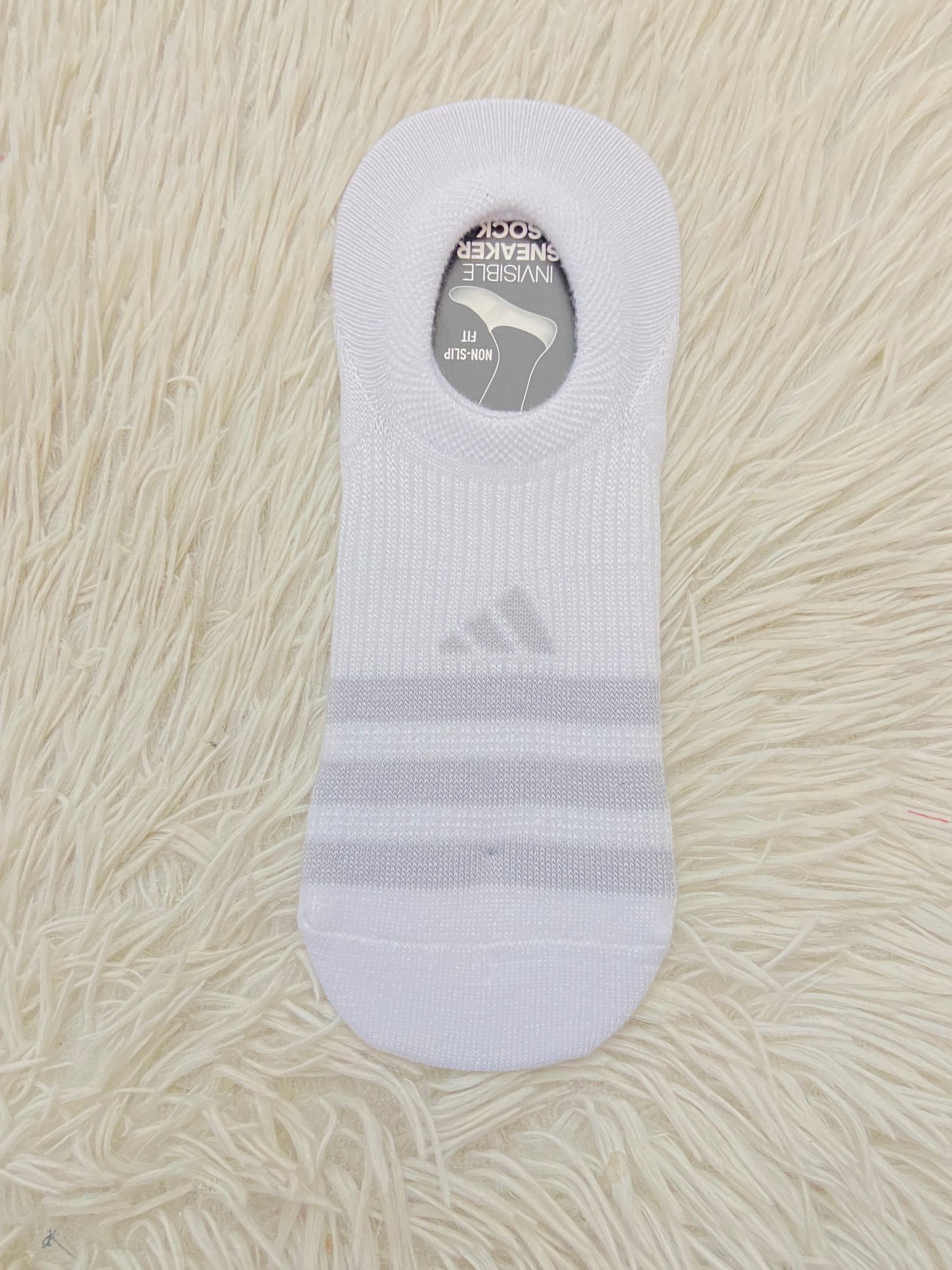 Plantilla/Medias Adidas original blanca con rayas gris.