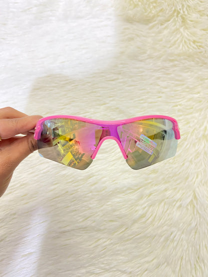 Lentes, rosados con negros y micas que cambian de color, con 100 % Polycarbonate y protección UV.