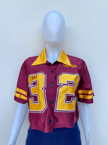 Top NFL original, rojo vino con el número 32 en color amarillo.