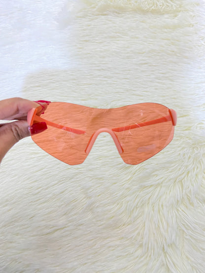 Lentes, naranja con montura color naranja pastel, protección UV  100 %.