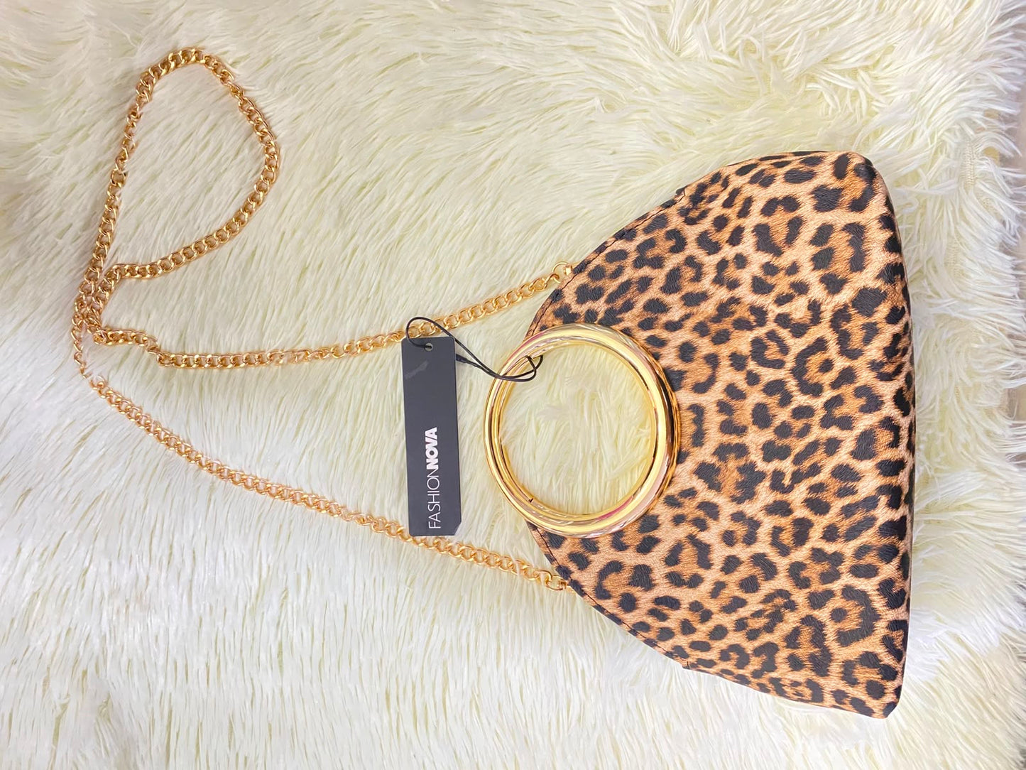 Cartera, marron con estampado de animal print y Cadena adicional.