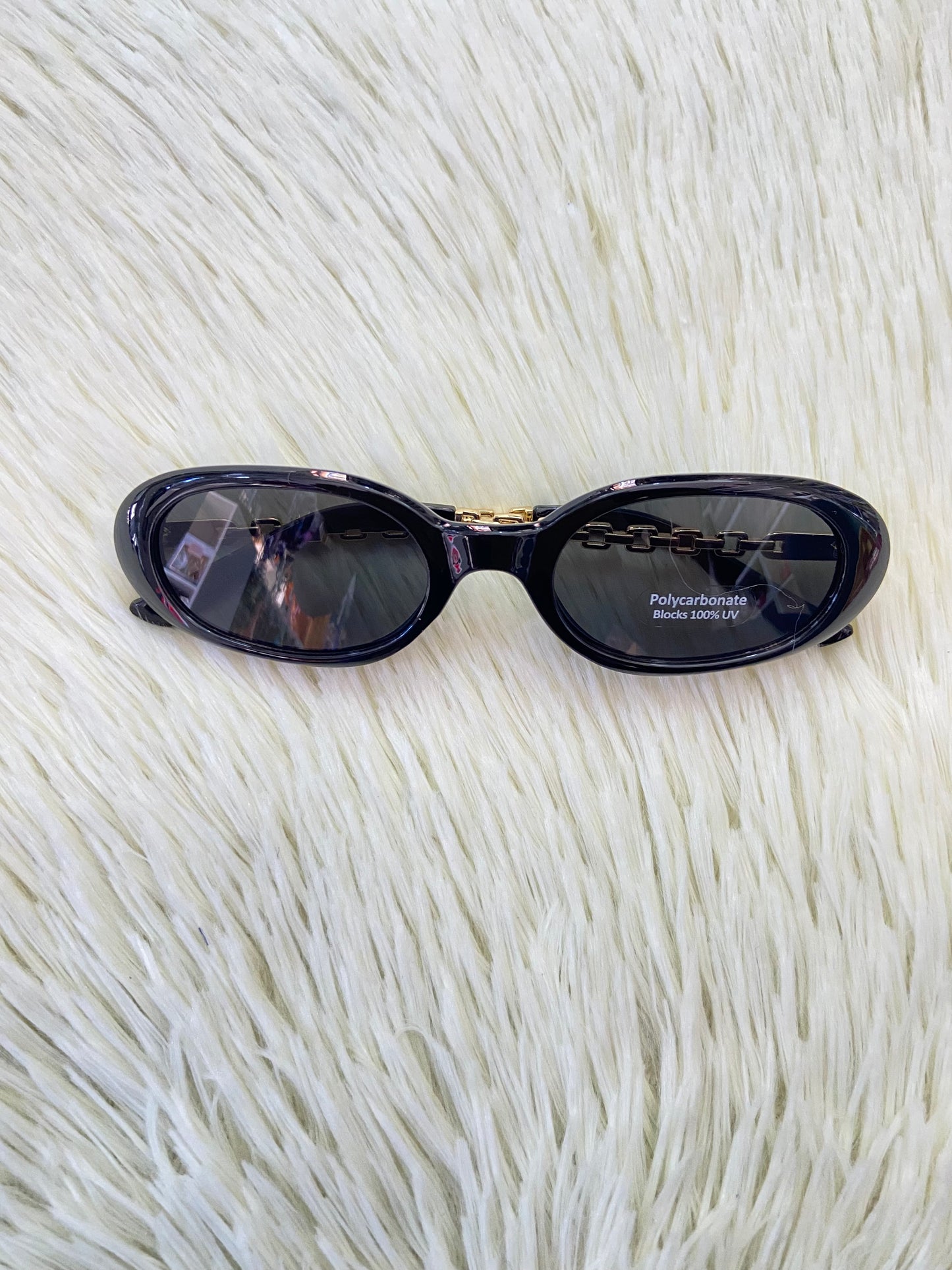 Lentes, negro con montura en estilo Cadena dorada y micas claras, ovalados, con protección UV 100-400