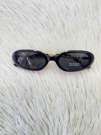Lentes, negro con montura en estilo Cadena dorada y micas claras, ovalados, con protección UV 100-400