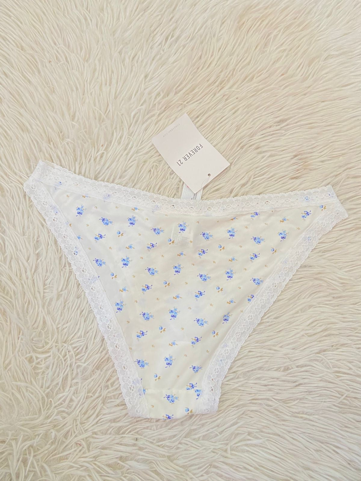 Panti Forever 21 original blanco con estampado de Flores azul.